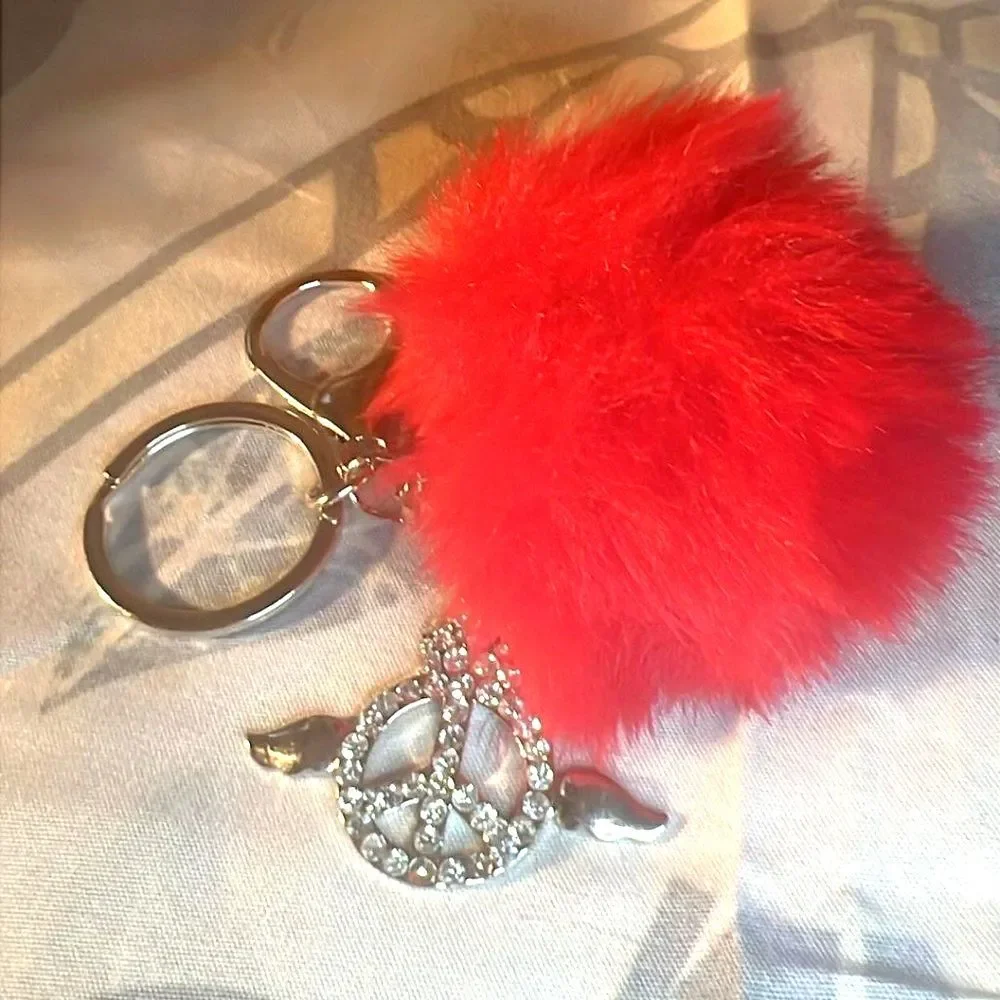 Purse Charm with Peace Sign with wings and Red Pom Pom. Purse Charm w/Key Ring